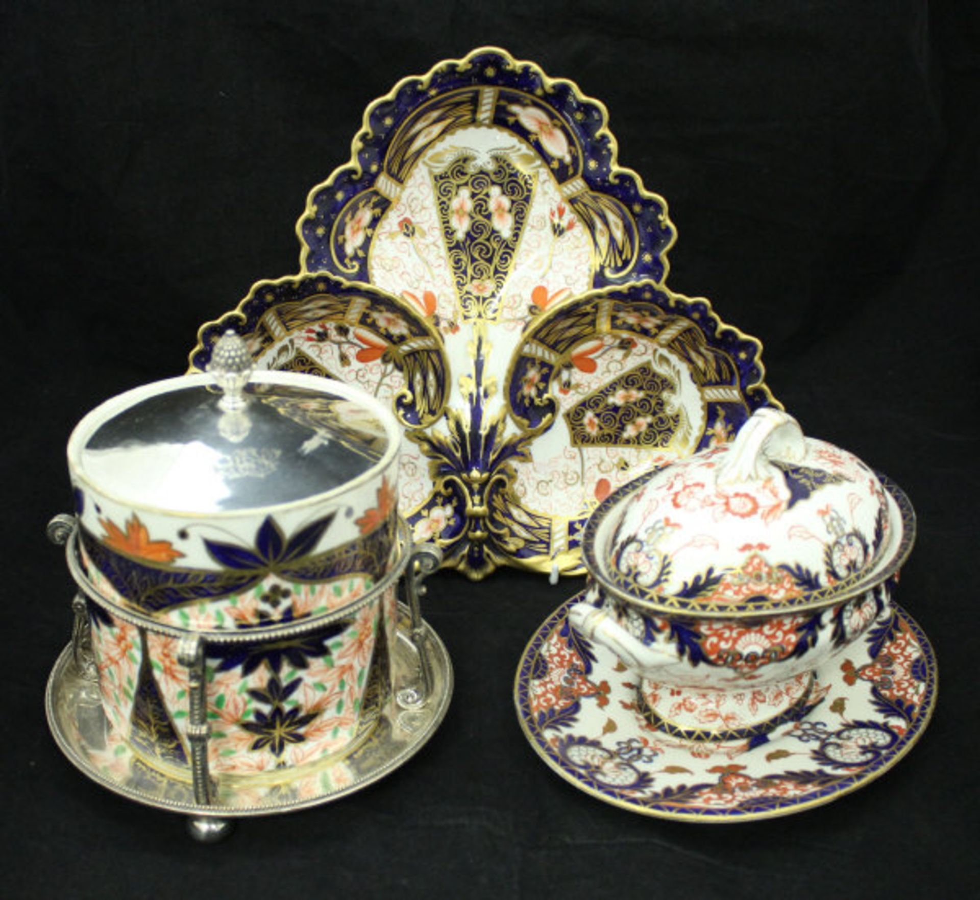 A Royal Crown Derby biscuit barrel, together with a Royal Crown Derby tureen on stand,