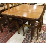 A Victorian walnut extending dining table, the rectangular top with canted corners on turned,