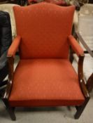 A George III mahogany Gainsborough type armchair with red floral upholstery
