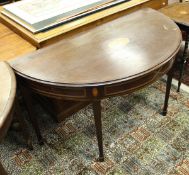 An Edwardian mahogany side table of demi-lune form,