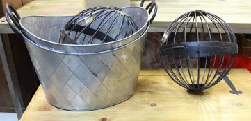 Two oval galvanised planters with wrought iron handles and two spherical iron candle cages