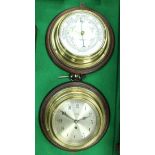 A brass cased ship's type clock with silvered dial and Arabic numerals inscribed "Barkers
