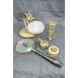 A brass framed table magnifying glass, a brass cased compass with magnifying glass,