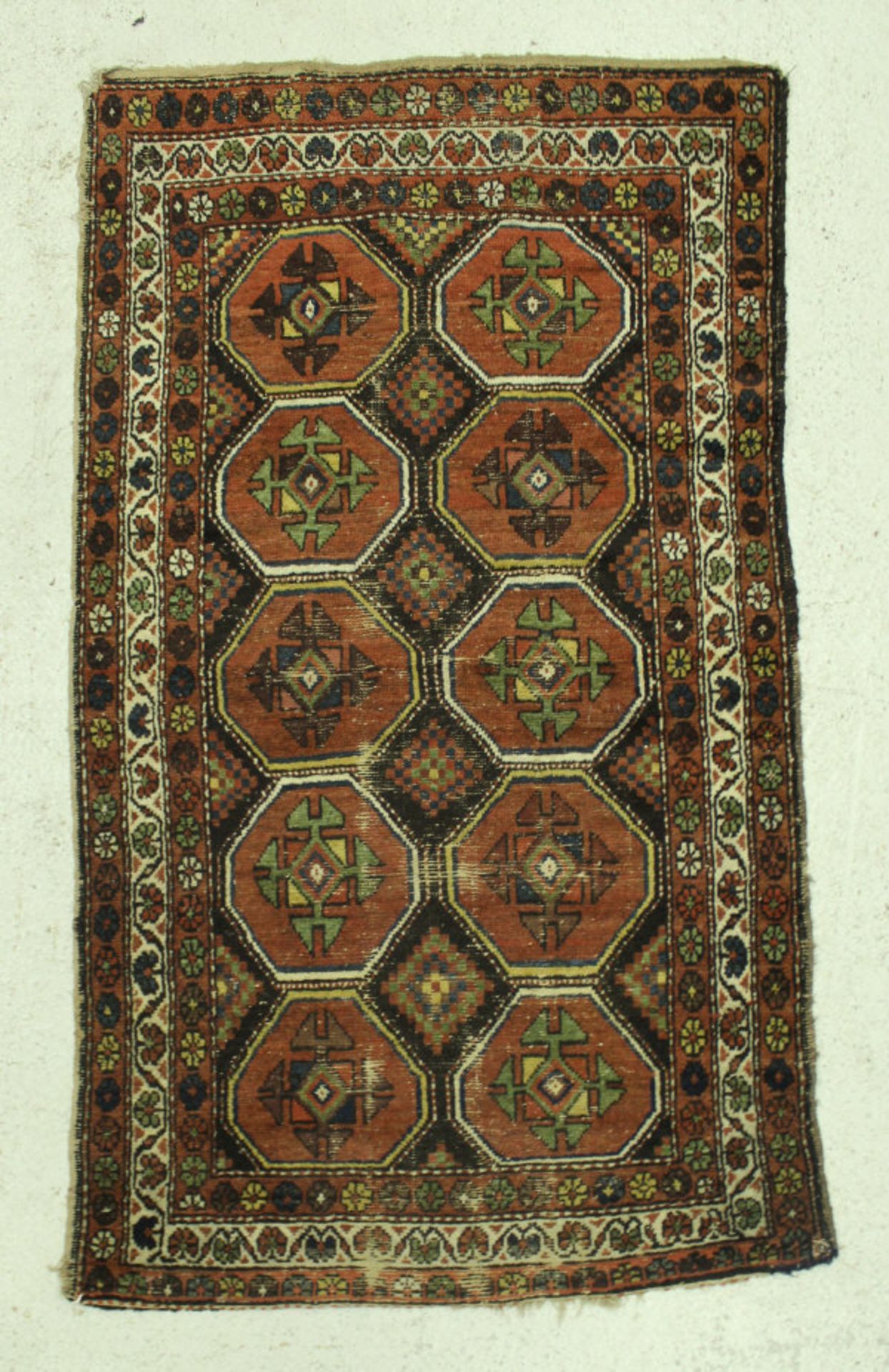 A Kazak rug, the central panel set with repeating medallions on a dark black ground, - Bild 3 aus 3