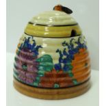 A Clarice Cliff "Bizarre" "Spring Crocus" honey pot and cover,