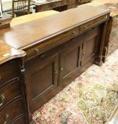 A modern Bassett mahogany side cabinet, the plain top over two cushion drawers,