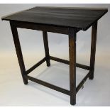 A provincial oak occasional table the plank top with cleated ends on square supports united by