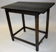 A provincial oak occasional table the plank top with cleated ends on square supports united by