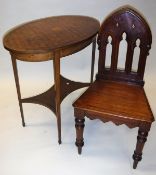 An Edwardian mahongay and parquetry inlaid oval occassional table on square tapered legs united by