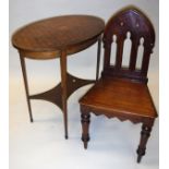 An Edwardian mahongay and parquetry inlaid oval occassional table on square tapered legs united by