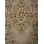 A Chinese superwash rug, the central panel set with floral decorated medallion on a lilac ground,