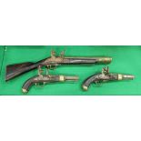A pair of theatrical flintlock pistols, the side panels inscribed "T Fort London - AR",