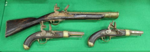 A pair of theatrical flintlock pistols, the side panels inscribed "T Fort London - AR",