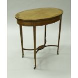 An Edwardian mahogany and inlaid occasional table, the oval top with inlaid decoration,