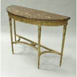 A giltwood and gesso bow fronted pier table in the George III taste with variegated marble top