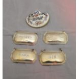 A set of four silver wine labels inscribed "Whisky", "Vodka",