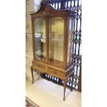 An Edwardian mahogany and inlaid display cabinet,