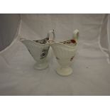 Two 18th Century Newhall porcelain cream jugs of helmet form,