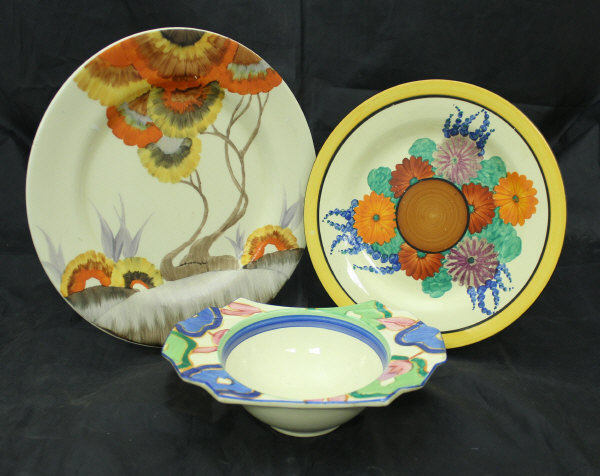 A Clarice Cliff "Bizarre" grapefruit dish, together with a Celtic harvest jug,