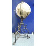 A modern 17th Century style globe on wrought iron Gothic stand