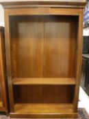 A modern cherrywood adjustable open bookcase
