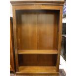 A modern cherrywood adjustable open bookcase