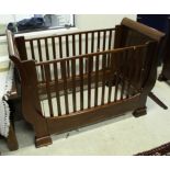 A Simon Horn cherrywood baby cot in the French sleigh bed style,