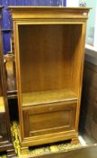 A Simon Horn cherrywood bookcase cabinet with adjustable shelving