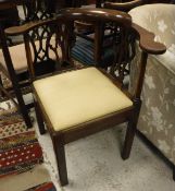 A late George III mahogany yoke back corner chair