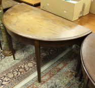 A circa 1900 mahogany side table of demi-lune form,