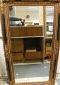 A reproduction gilt and painted mirror