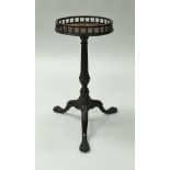A mahogany kettle stand in the George III taste, the circular top with galleried edge,