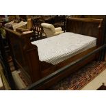 A 19th Century Continental walnut sleigh bed with mattress CONDITION REPORTS