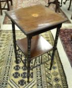 A circa 1900 mahogany and inlaid two tier occasional table in the manner of EW Godwin,