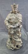A Japanese carved treen ware figure of a warrior or temple guard,