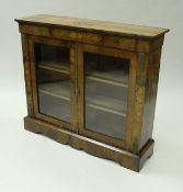 A Victorian walnut and marquetry inlaid side cabinet,