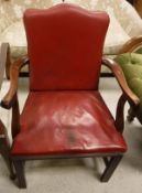 A mahogany framed red leather upholstered carver chair
