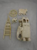 A collection of early 20th Century carved ivory pieces to include an elephant and howda,