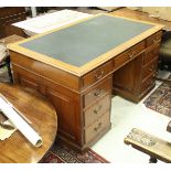 An early 20th Century mahogany kneehole double pedestal desk