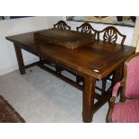 A modern oak farmhouse draw leaf style kitchen table the plank top with cleated ends on square