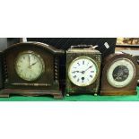 A 19th Century French ebonised cased mantel clock with circular enamelled dial and Roman numerals,