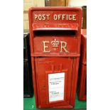A red painted metal postbox inscribed "Post Office EIIR"