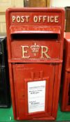 A red painted metal postbox inscribed "Post Office EIIR"