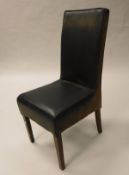 A set of eight upholstered high back dining chairs on square tapered legs