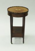 A 19th Century mahogany and inlaid side table of oval form,
