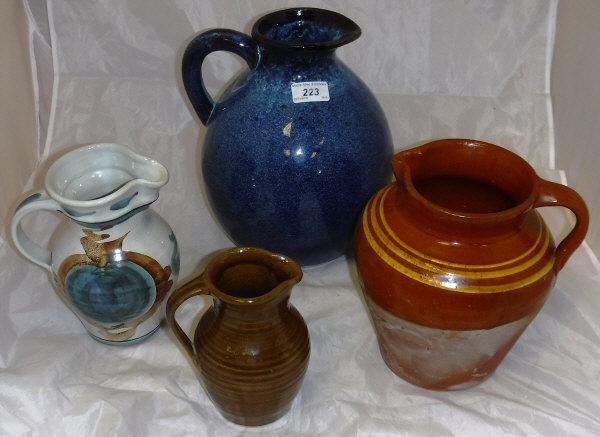 A collection of six various studio pottery and other jugs,