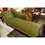 A Victorian chaise longue with walnut show frame and carved scrollwork decoration,