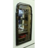 An 18th Century black lacquered and chinoiserie decorated framed wall mirror with two section plate,