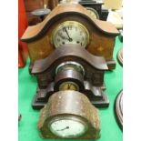 An Edwardian mahogany and inlaid cased mantel clock, a German oak cased mantel clock,