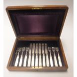 A mahogany cased set of late Victorian silver mounted mother of pearl handled fruit knives and